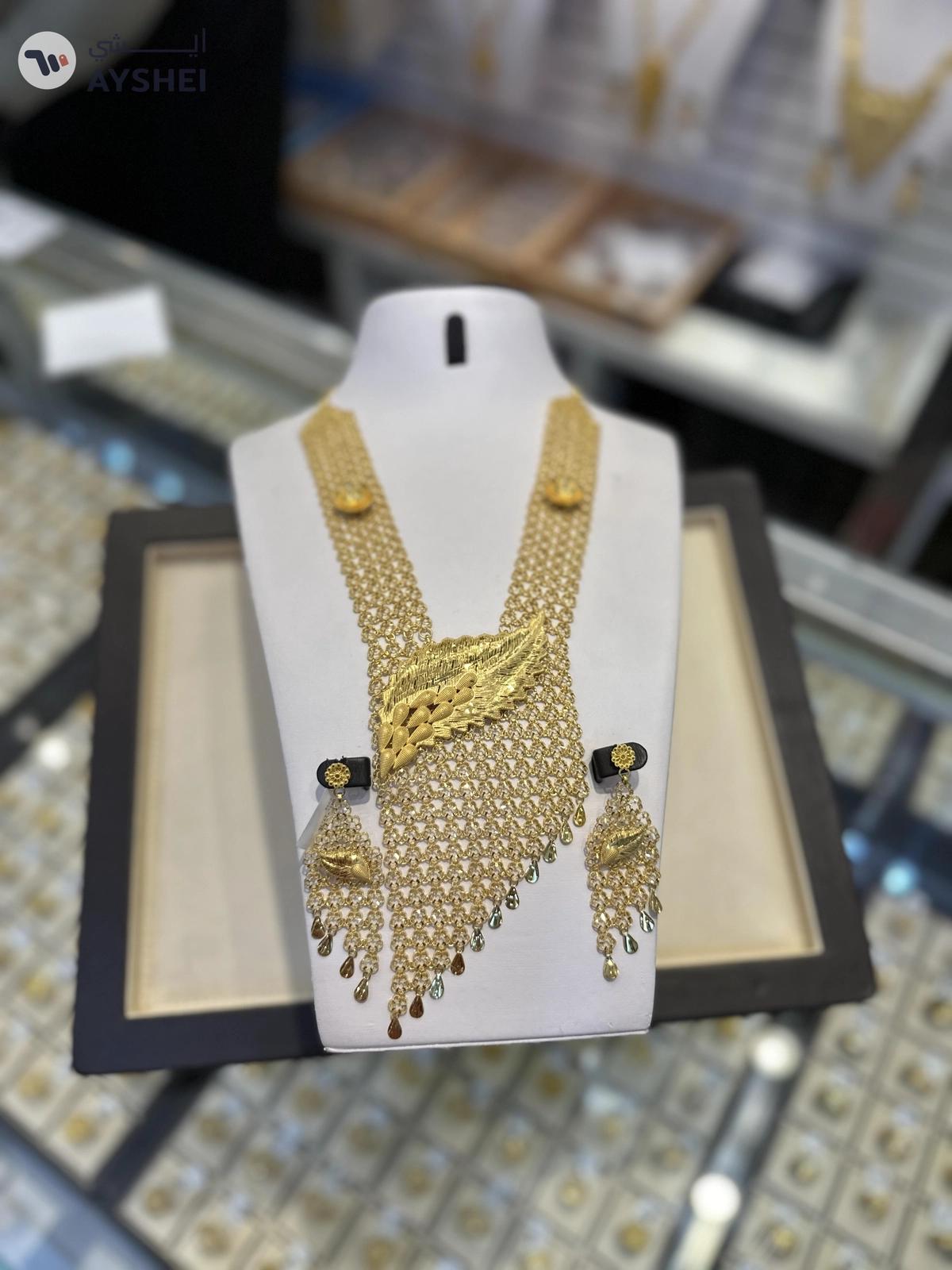 "Luxurious 22 Carat Gold Jewelry Set Item: Exquisite Gold Necklace and Earring Set Weight: 153.75 grams Making Charges: AED 5 per gram"-1-1