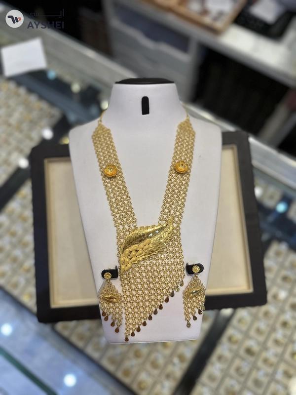 "Luxurious 22 Carat Gold Jewelry Set Item: Exquisite Gold Necklace and Earring Set Weight: 153.75 grams Making Charges: AED 5 per gram"
