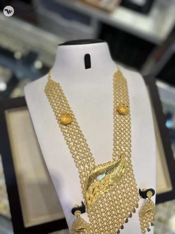 "Luxurious 22 Carat Gold Jewelry Set Item: Exquisite Gold Necklace and Earring Set Weight: 153.75 grams Making Charges: AED 5 per gram"