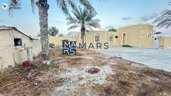 Perfectly located on Main Street residential plot 16000 sqft for sale in Al khazamia