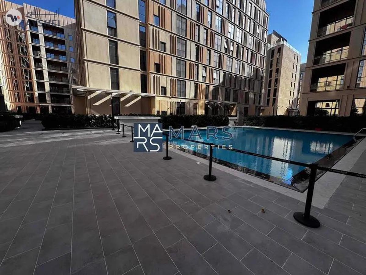 Spacious one bedroom with kitchen appliances in modern community-0-landscape