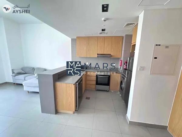 Spacious one bedroom with kitchen appliances in modern community
