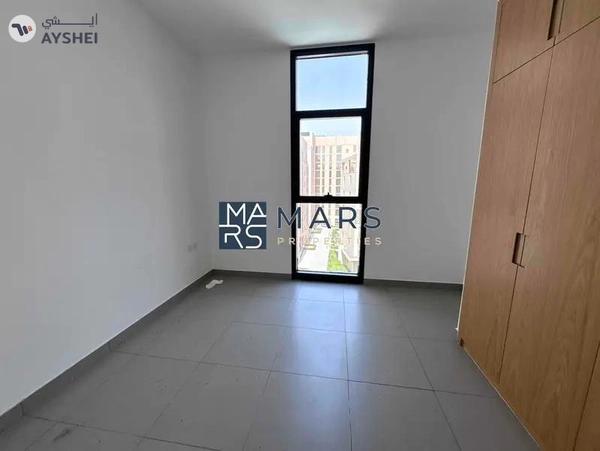 Spacious one bedroom with kitchen appliances in modern community
