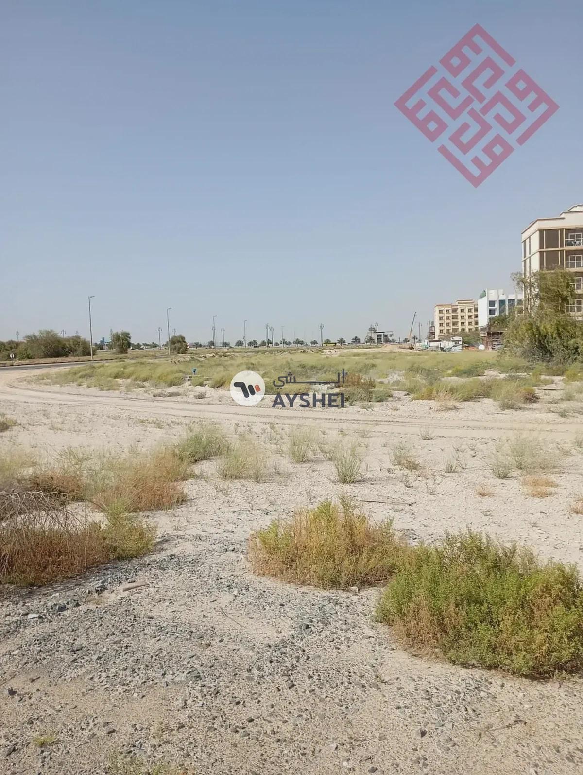 Commercial land for sale in Al-Houshi area in Sharjah with a good size and prime location - Best Price-0-0