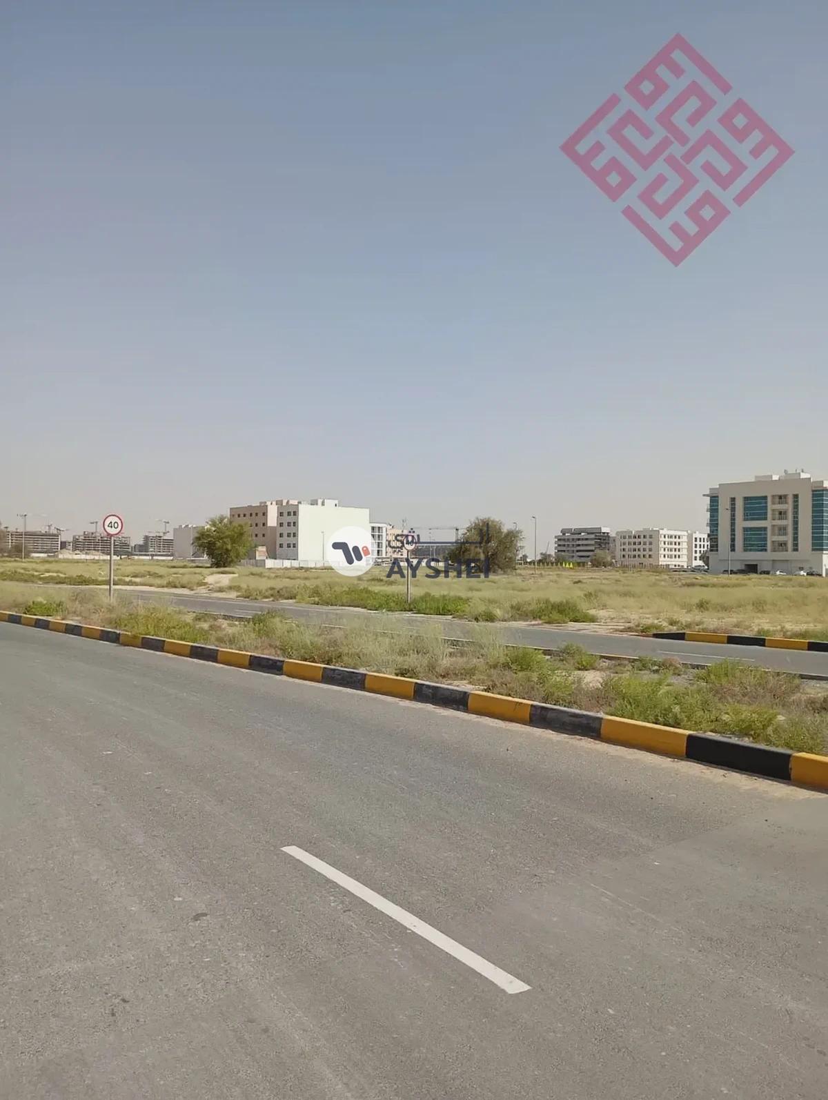 Commercial land for sale in Al-Houshi area in Sharjah with a good size and prime location - Best Price-1-portrait