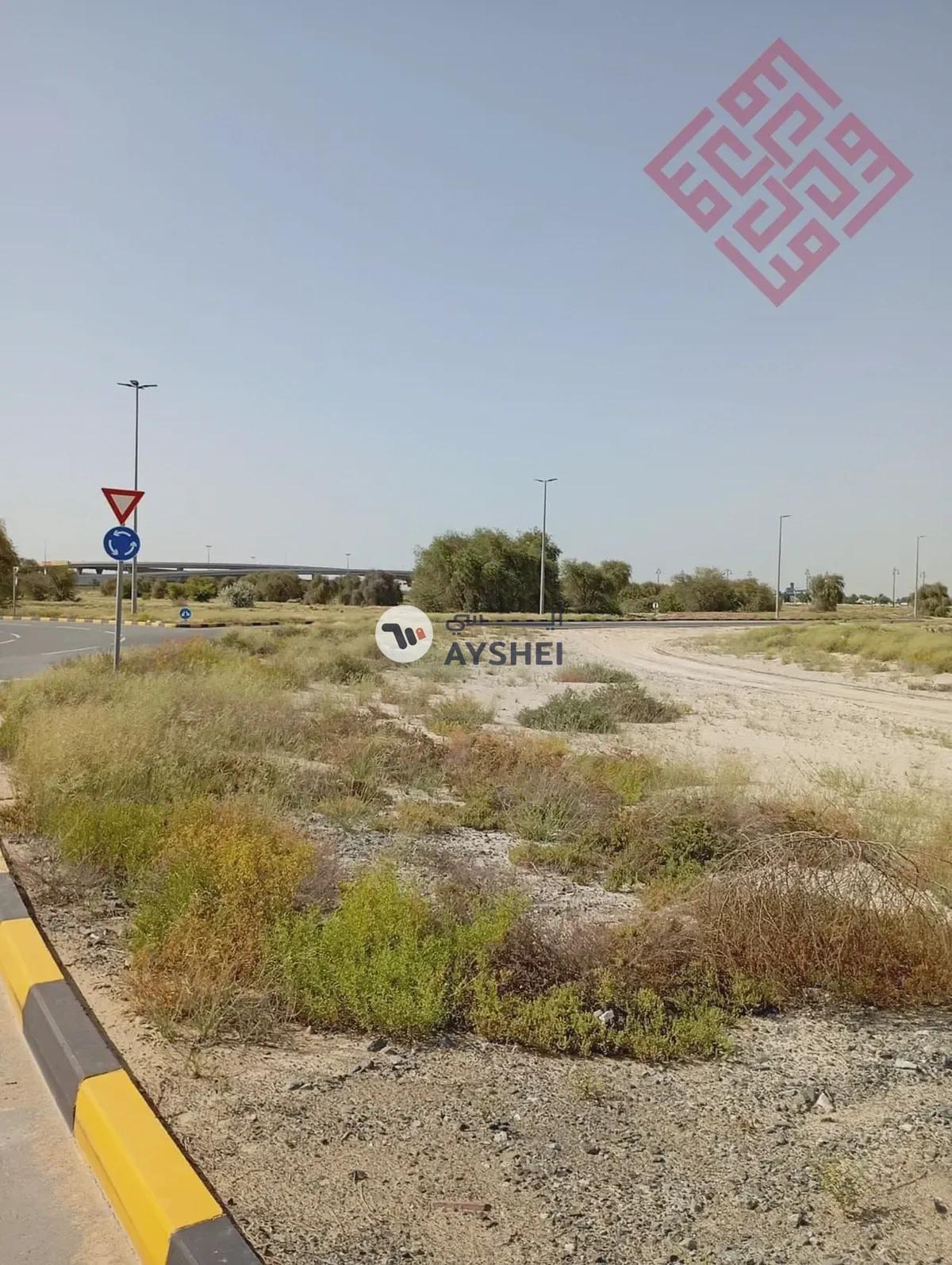 Commercial land for sale in Al-Houshi area in Sharjah with a good size and prime location - Best Price-1-portrait