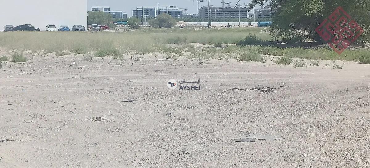 Commercial land for sale in Al-Houshi area in Sharjah with a good size and prime location - Best Price-7-7